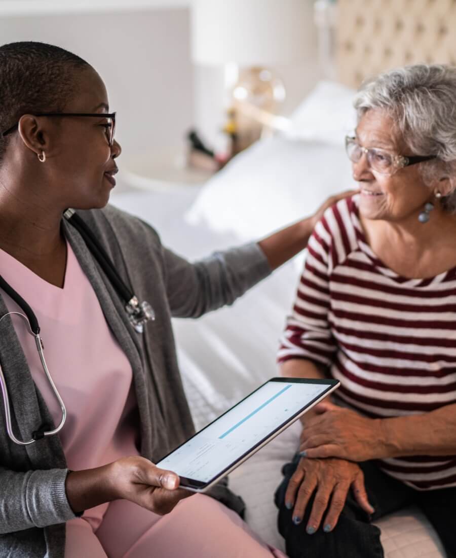 compassionate doctor visiting patient in home